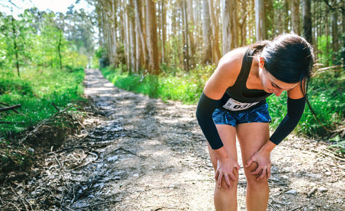 Woman exercising in forest