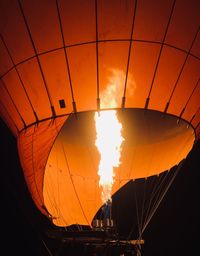 Low angle view of illuminated hot air balloons