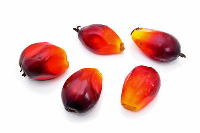 Close-up of fruits over white background