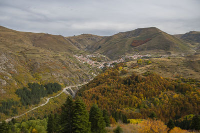 Scenic view of mountain village against sky