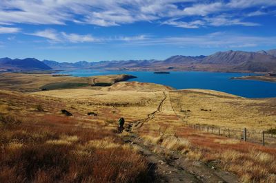 Scenic view of landscape and mountains against sky