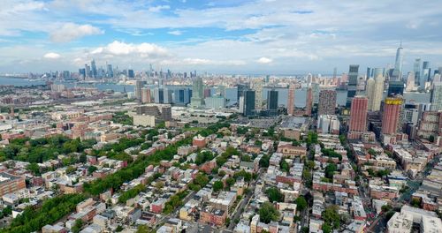 High angle view of buildings in city against sky