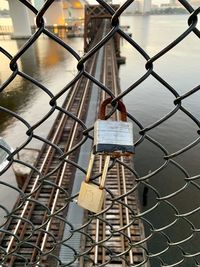 Close-up of padlocks on fence