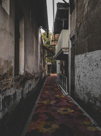 Footpath amidst buildings