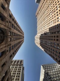 Low angle view of skyscrapers against sky