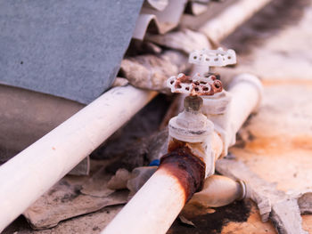 High angle view of hand holding pipe