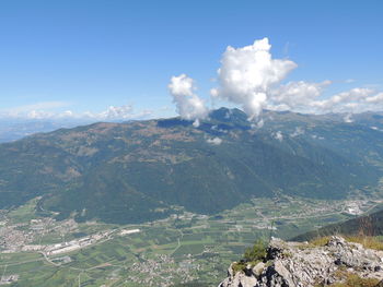 Aerial view of landscape and mountains against sky