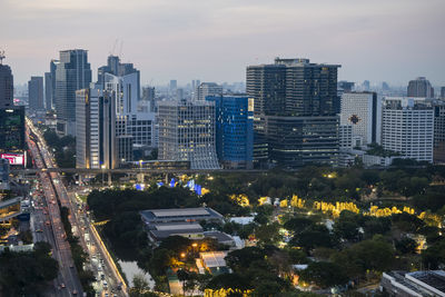 High angle view of buildings in city against sky