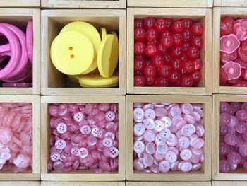 Full frame shot of buttons in container
