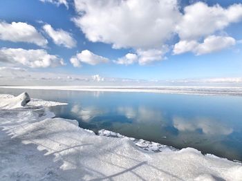 Scenic view of frozen lake against sky