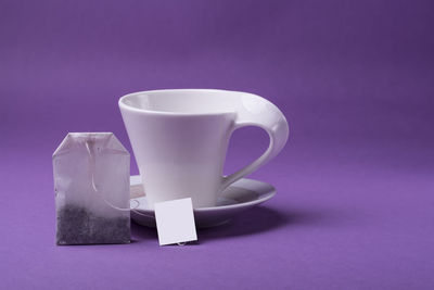 Close-up of coffee cup on table