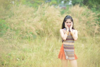 Woman standing on field