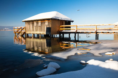 Pier over lake during winter