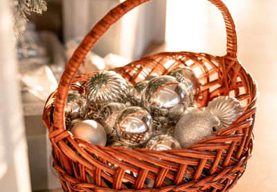 Close-up of christmas decorations in wicker basket