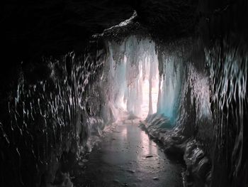 Scenic view of sea seen through cave