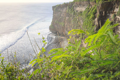 Scenic view of sea with mountains in background