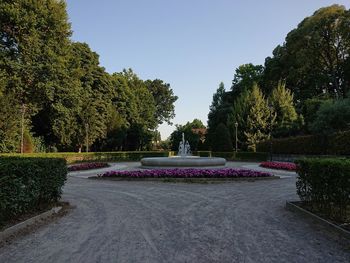 Scenic view of fountain in park against clear sky