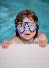 Portrait of girl swimming in pool