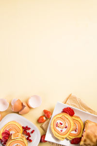 Close-up of cupcakes on table against white background