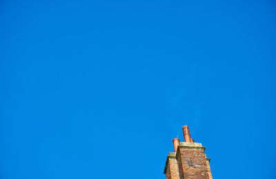 Low angle view of building against blue sky