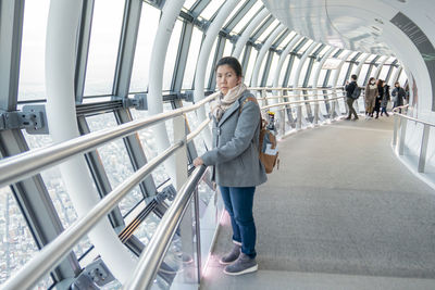 Women walking in corridor of people