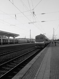 Train at railroad station against sky