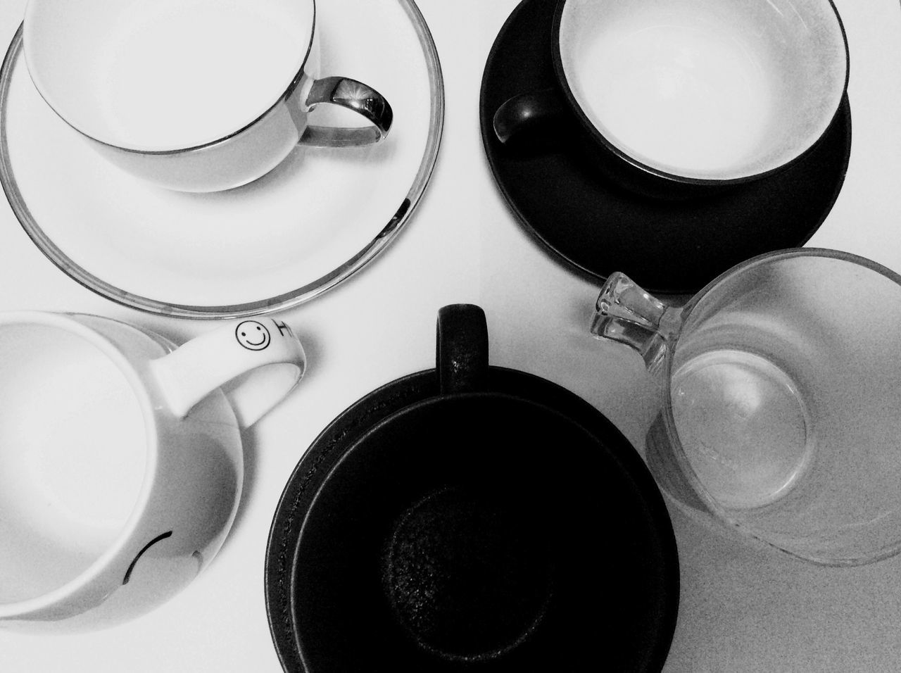 indoors, still life, table, high angle view, coffee cup, white color, plate, close-up, cup, no people, spoon, drink, directly above, saucer, food and drink, fork, empty, kitchen utensil, technology, large group of objects