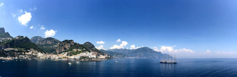 Panoramic view of sea against blue sky