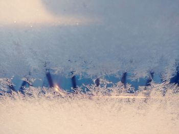 Close-up of snow against sky