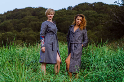 Portrait of women standing on grass