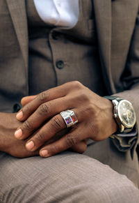 Midsection of man holding hands