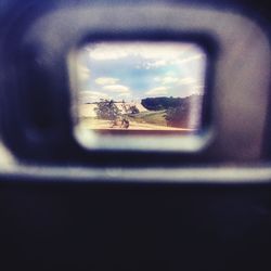 Reflection of sky seen through car window