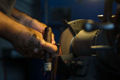 Cropped hands of man working at workshop