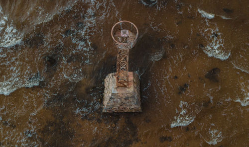 High angle view of lighthouse in sea