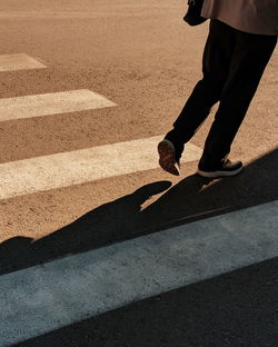 Low section of man on road