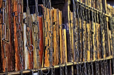 Full frame shot of old books in shelf at library