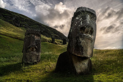 Old ruins on field against sky