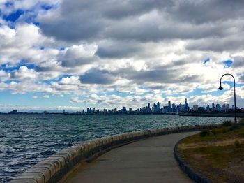 View of city against cloudy sky