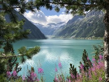 Scenic view of lake and mountains against sky