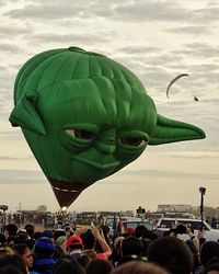 People in city against sky