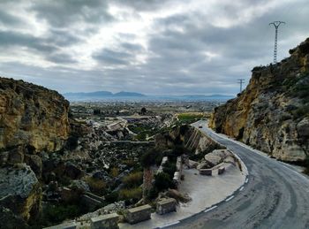 Panoramic view of road amidst mountains against sky