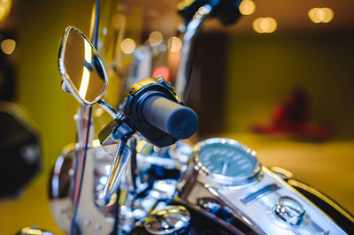 Close-up of motorcycle in illuminated room