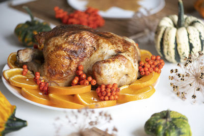 Traditional festive dinner with delicious roasted turkey served on table