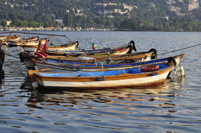 Boats moored in lake