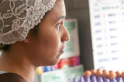 Close-up of woman looking away in store
