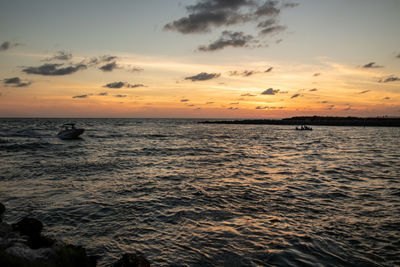 Scenic view of sea against sky during sunset