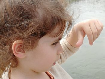 Close-up portrait of a girl in water