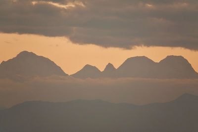 Scenic view of mountains against sky during sunset