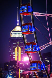 Low angle view of illuminated buildings at night