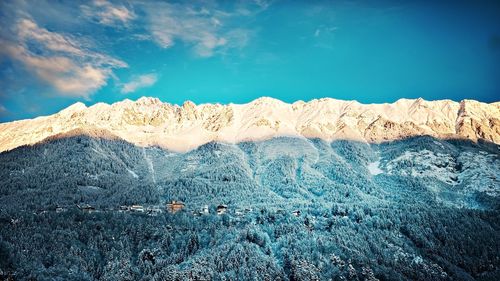 Scenic view of snowcapped mountains against sky